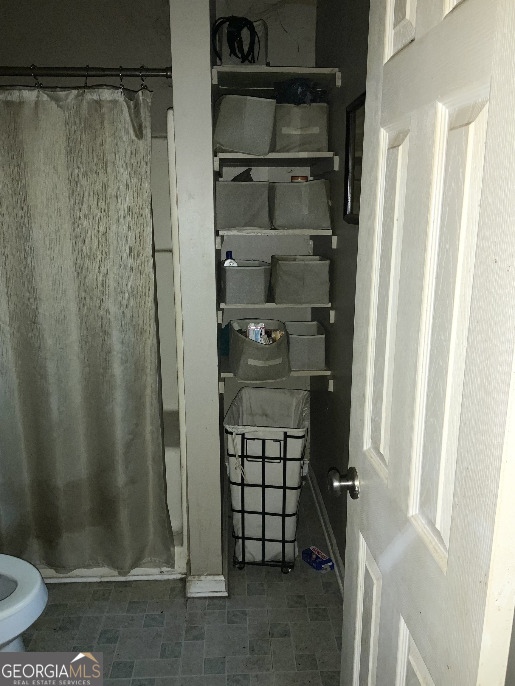 10065 Brass Ring Road Jonesboro, GA 30238 - Photo 33 of 48 a bathroom with a shower and toilet