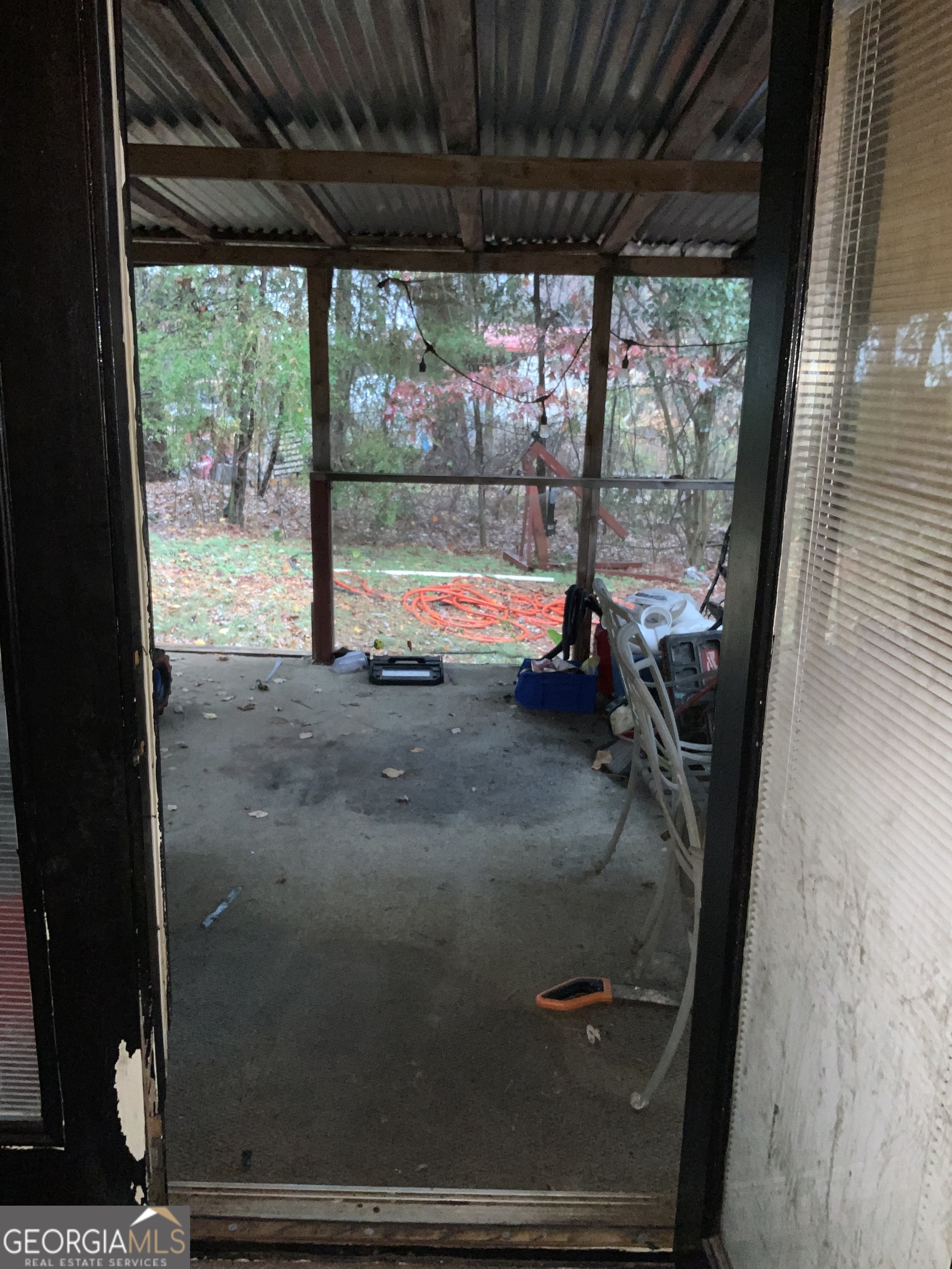 10065 Brass Ring Road Jonesboro, GA 30238 - Photo 37 of 48 a view of a porch with furniture