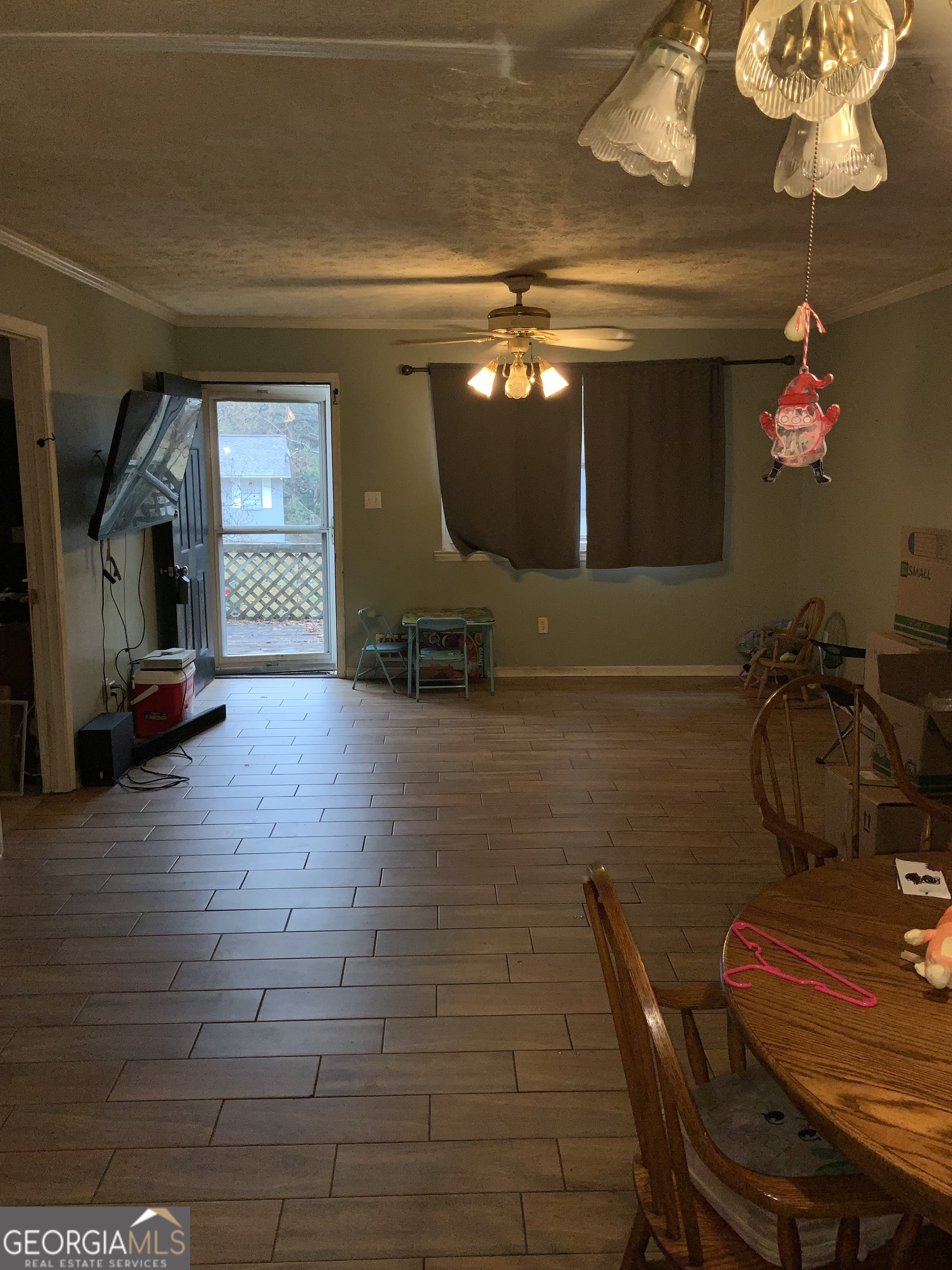 10065 Brass Ring Road Jonesboro, GA 30238 - Photo 45 of 48 a room with furniture and a chandelier