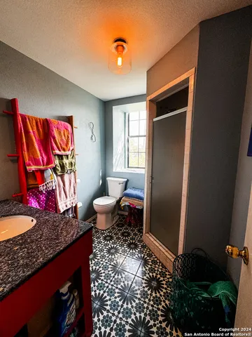 a living room with blue lights with furniture and wooden floor