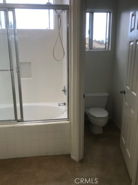 5 Laconia Irvine, CA 92614 - Photo 11 of 35 a bathroom with a toilet and a shower