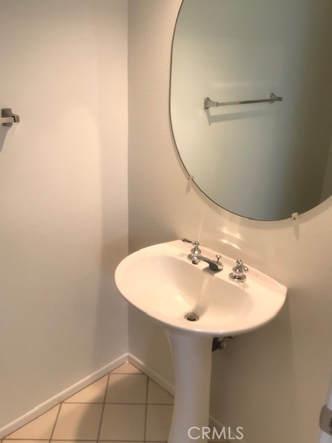 5 Laconia Irvine, CA 92614 - Photo 7 of 35 a bathroom with a sink a mirror and a vanity