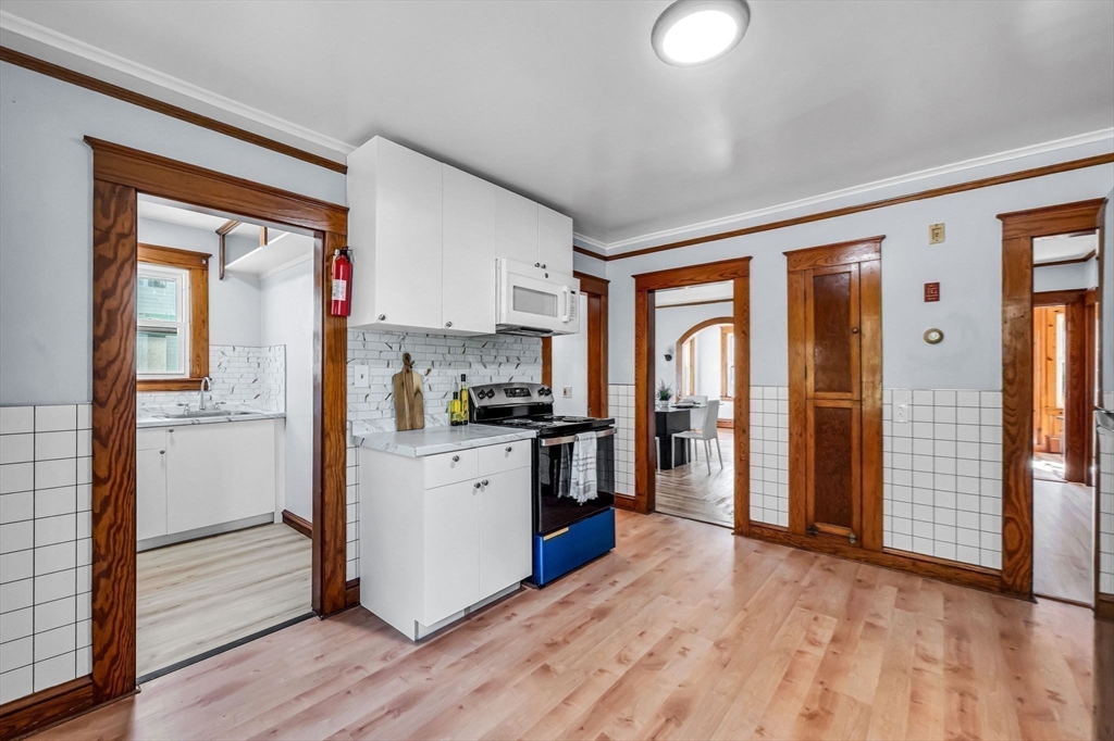 28 Maple Avenue Ware, MA 01082 - Photo 16 of 42 a kitchen with stainless steel appliances granite countertop a refrigerator and a stove top oven