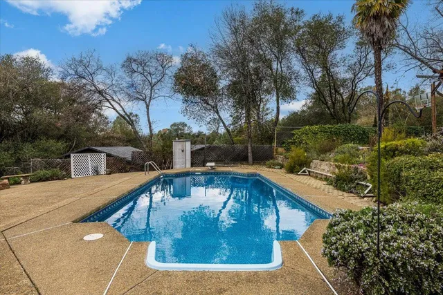 a view of a swimming pool with a house