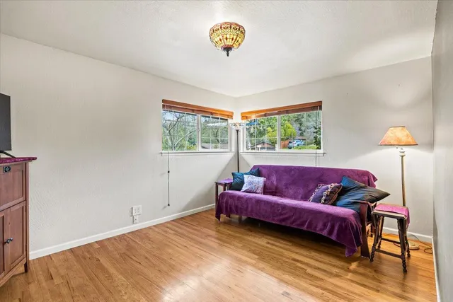 a living room with a couch and a window
