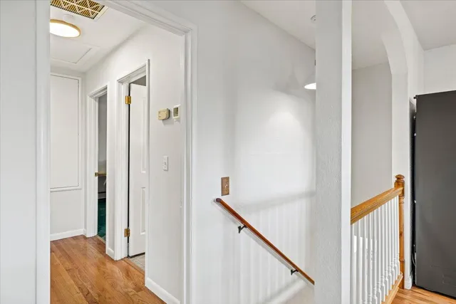 a view of a hallway with furniture and entryway