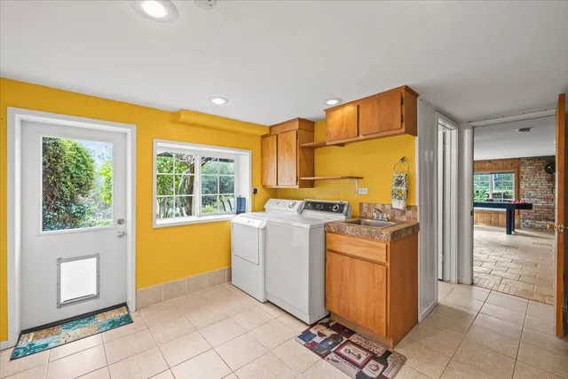 a kitchen with a stove a refrigerator and cabinets