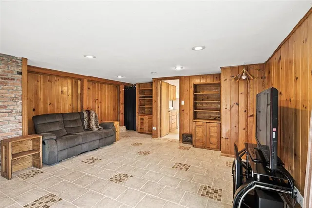 a large bedroom with a large bed and furniture