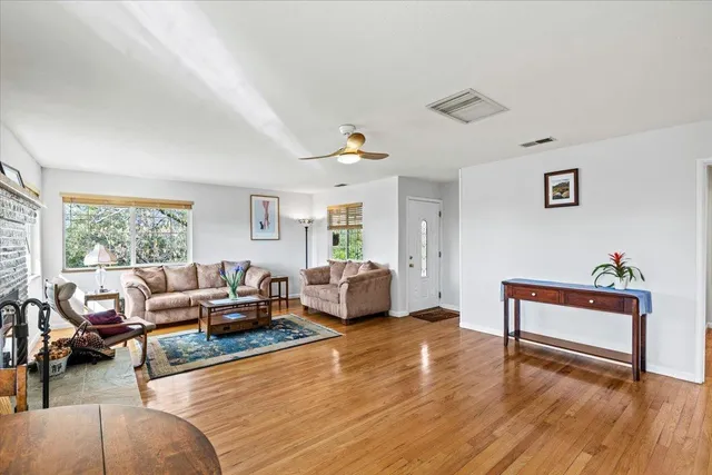a living room with furniture or couch and a wooden floor