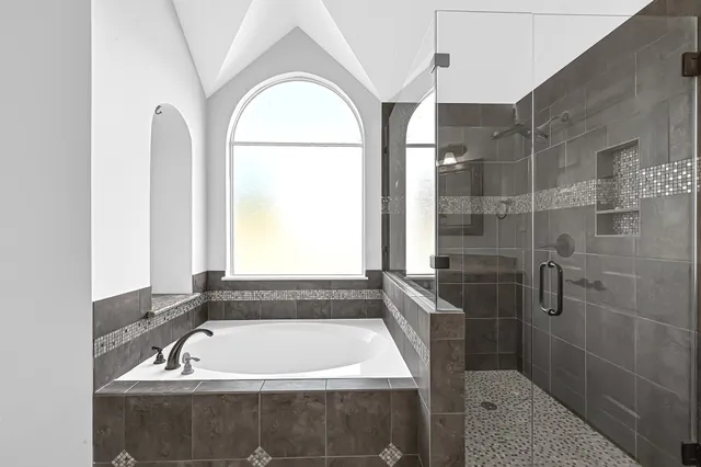 a bathroom with a bath tub and a sink