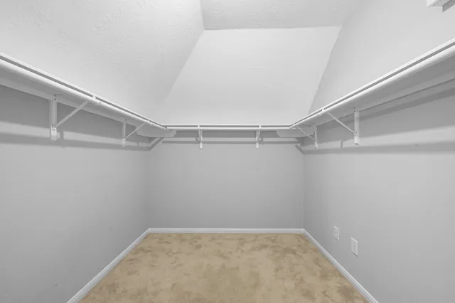 a view of a room with shelf on the wall