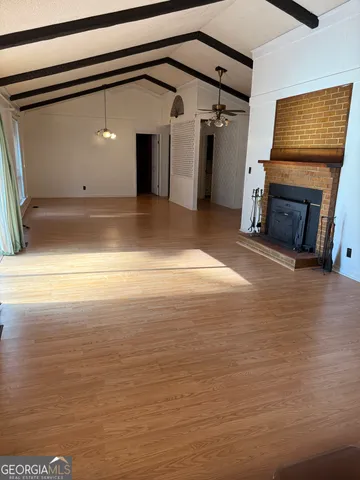 a kitchen with wooden cabinets sink and window