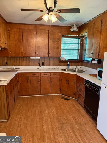 a view of a room with furniture and window