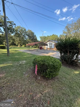 a view of a livingroom with furniture and a flat screen tv