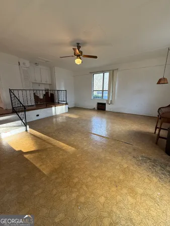 a kitchen with wooden cabinets sink and window