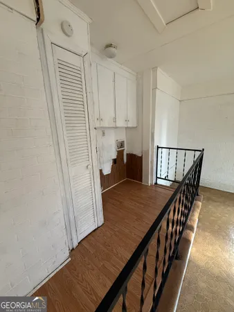 a spacious bathroom with a vanity a sink a mirror and a bathtub