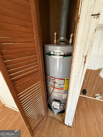 a view of a livingroom with furniture wooden floor and windows