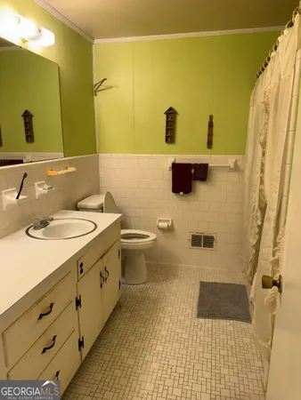 a bathroom with a double vanity sink and mirror