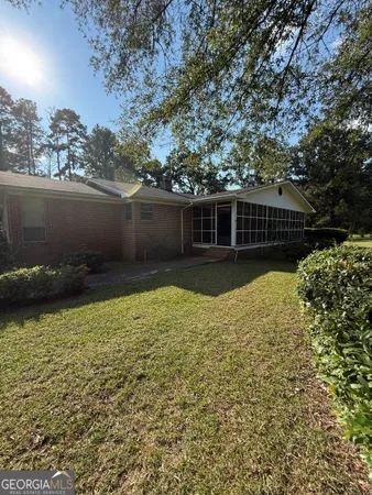a view of a car park in front of the house