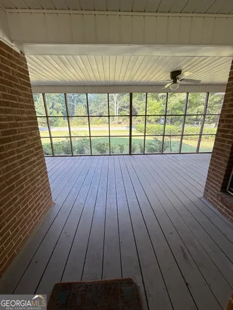 a view of a kitchen with a sink hardwood floor and a window