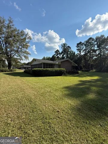 a view of a lake with houses in the background