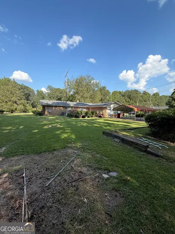 a view of a golf course with a lake