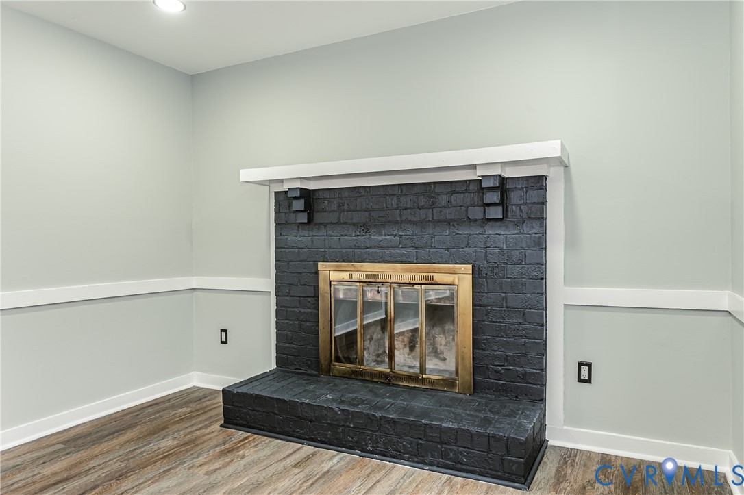 113 Eastman Road Chesterfield, VA 23236 - Photo 11 of 47 a room with fireplace and a wooden floor