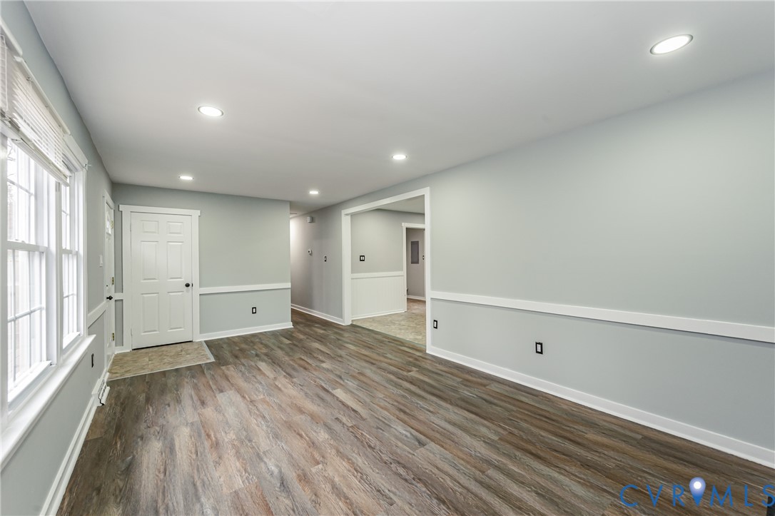 113 Eastman Road Chesterfield, VA 23236 - Photo 12 of 47 a view of an empty room with wooden floor and a window