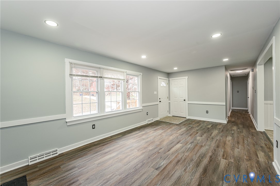 113 Eastman Road Chesterfield, VA 23236 - Photo 13 of 47 an empty room with wooden floor and windows