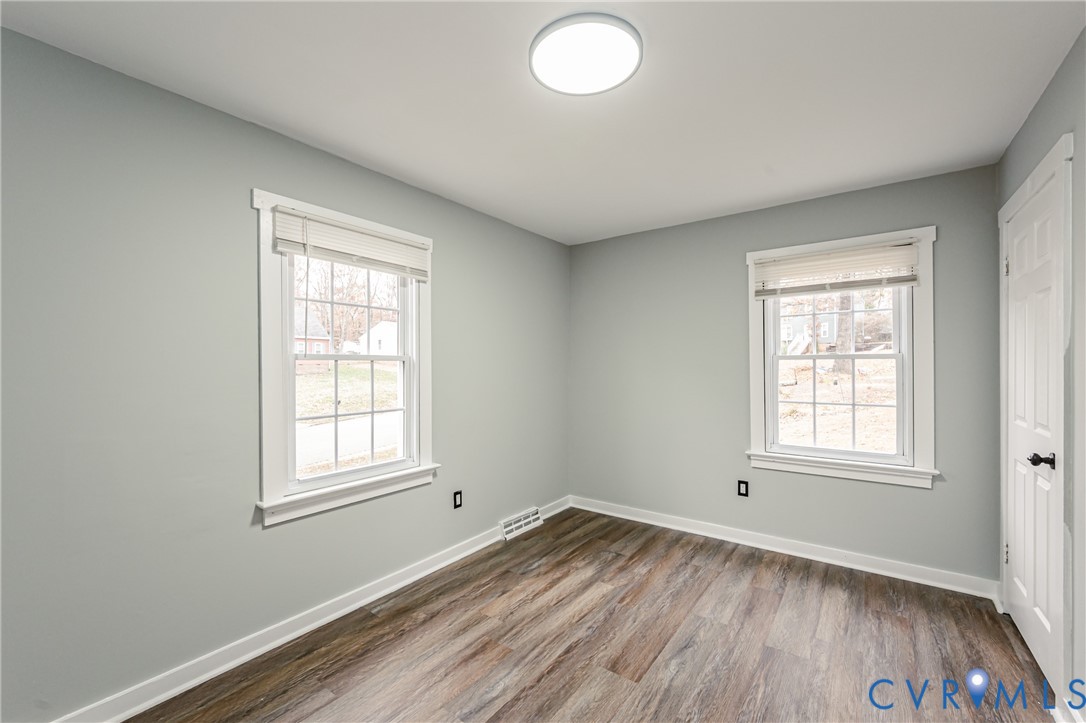 113 Eastman Road Chesterfield, VA 23236 - Photo 27 of 47 an empty room with wooden floor and windows
