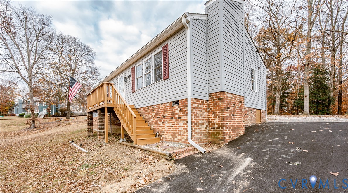 113 Eastman Road Chesterfield, VA 23236 - Photo 3 of 47 a front view of a house with a yard