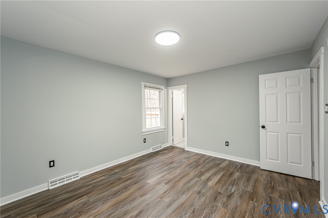 113 Eastman Road Chesterfield, VA 23236 - Photo 34 of 47 a view of room with window and wooden floor