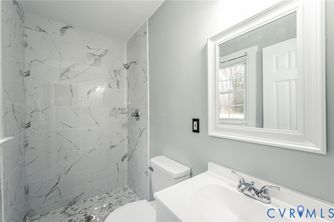 113 Eastman Road Chesterfield, VA 23236 - Photo 37 of 47 a bathroom with a sink toilet and shower