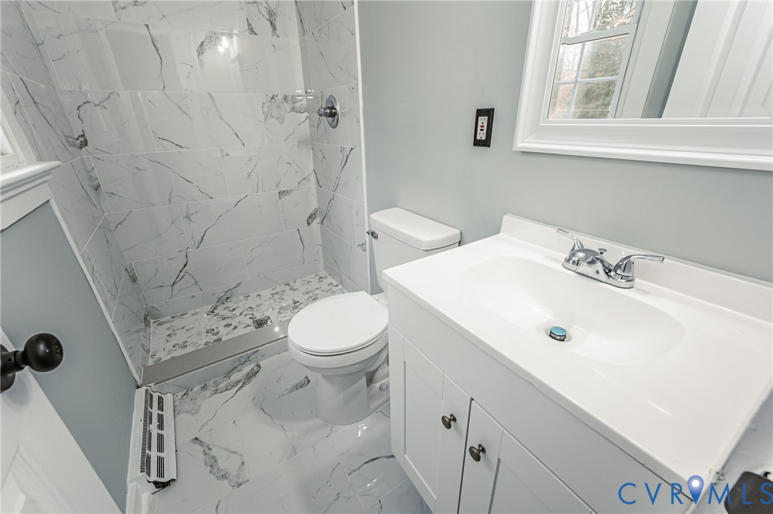 113 Eastman Road Chesterfield, VA 23236 - Photo 38 of 47 a bathroom with a sink a toilet and shower