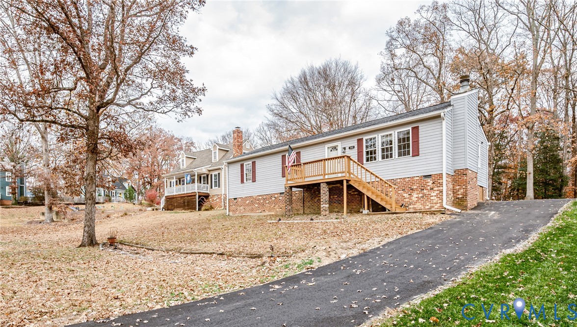 113 Eastman Road Chesterfield, VA 23236 - Photo 4 of 47 a view of a house with a yard covered in snow