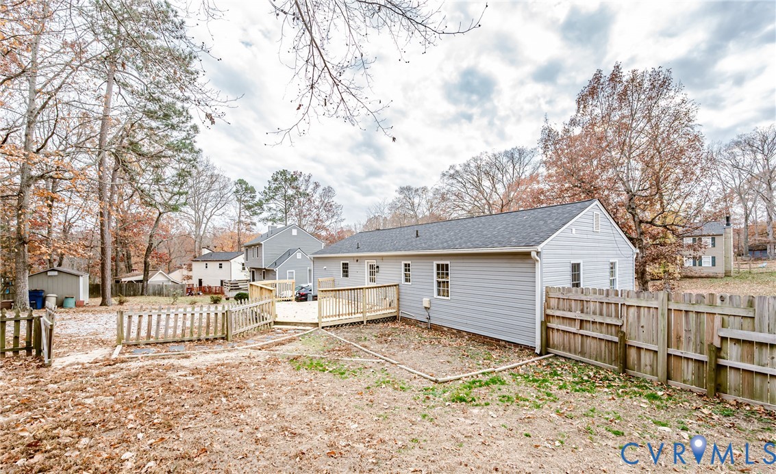 113 Eastman Road Chesterfield, VA 23236 - Photo 47 of 47 a view of a house with a wooden bench next to a yard