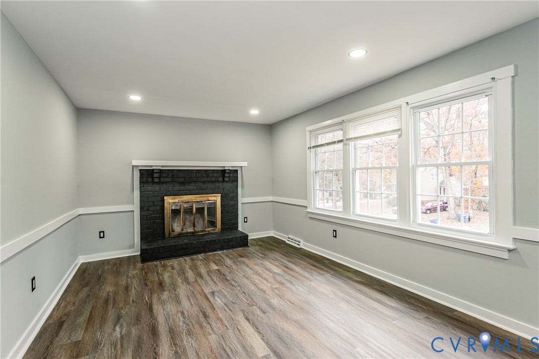 113 Eastman Road Chesterfield, VA 23236 - Photo 10 of 47 a view of an empty room with a window and fireplace