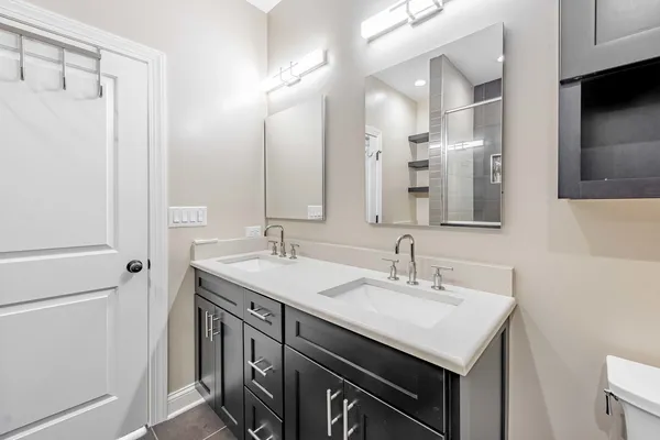 a kitchen with a sink and a refrigerator