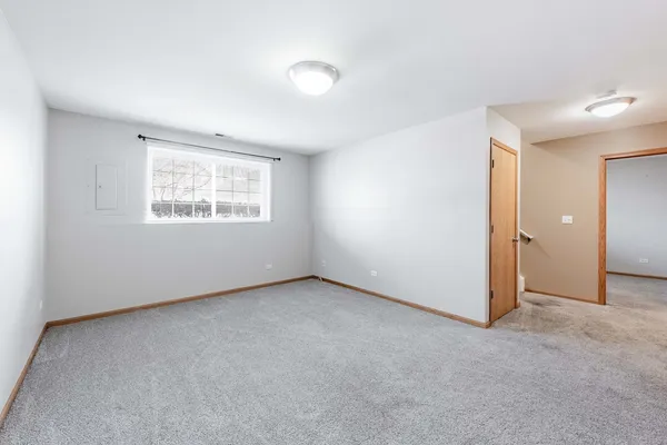an empty room with a empty space and windows