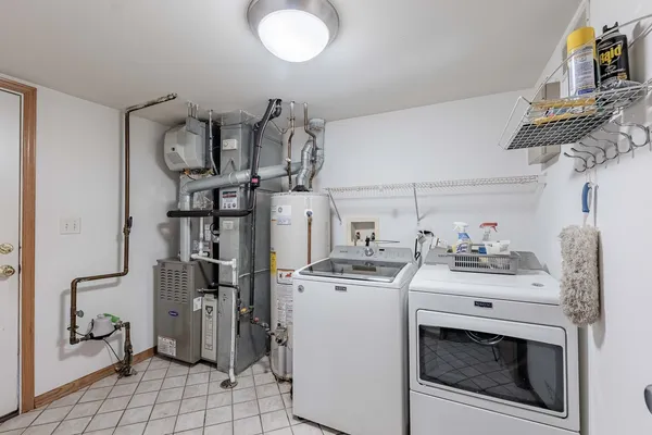 a view of storage and utility room with washer and dryer