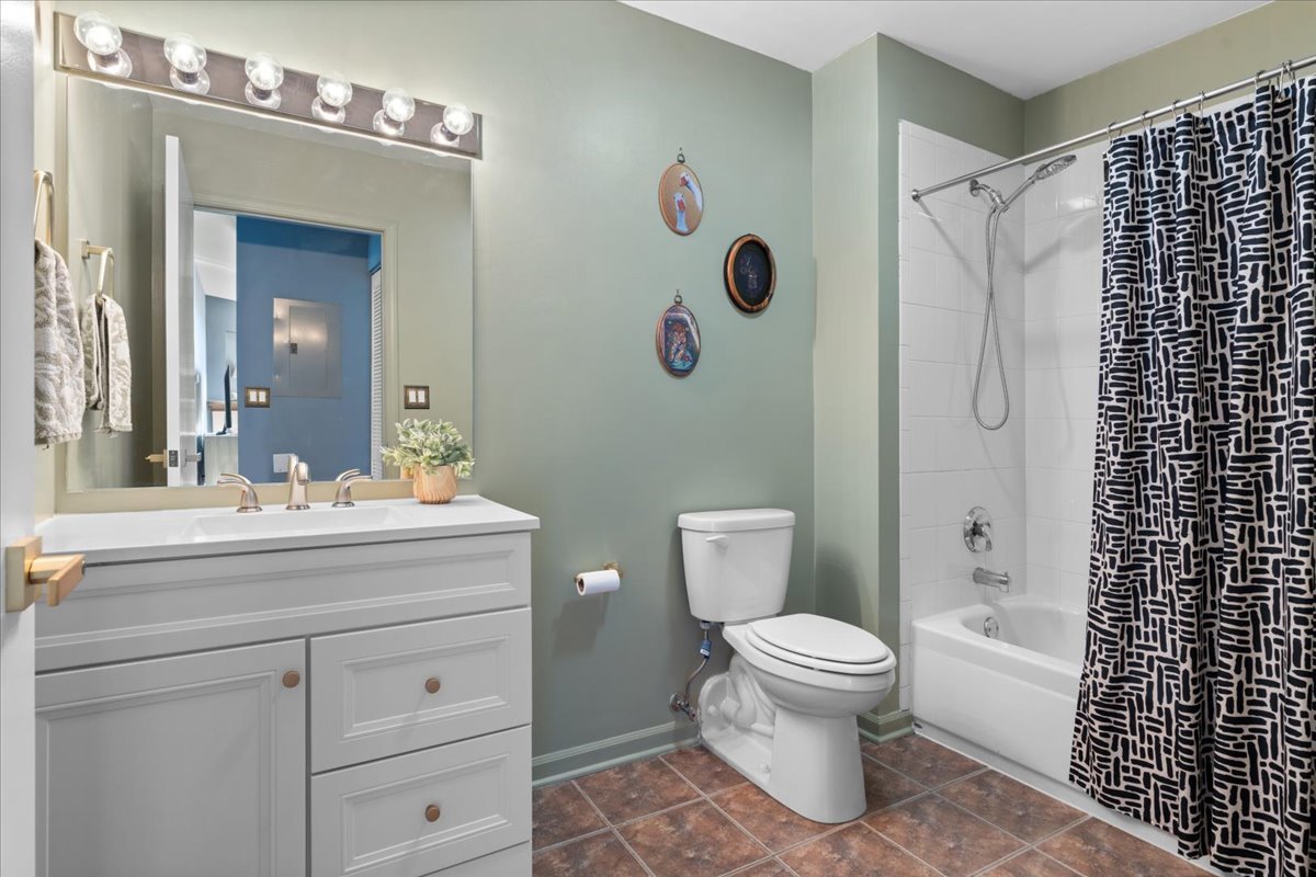 2337 West Wolfram Street, Unit 514 Chicago, IL 60618 - Photo 12 of 15 a bathroom with a sink a toilet and shower