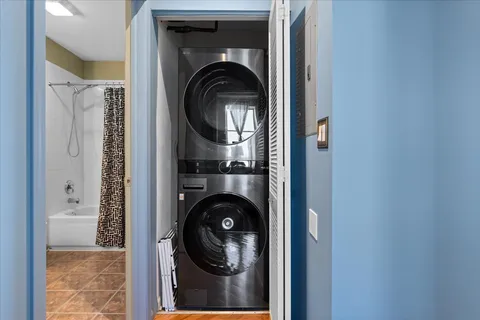 a view of a hallway with washer and dryer