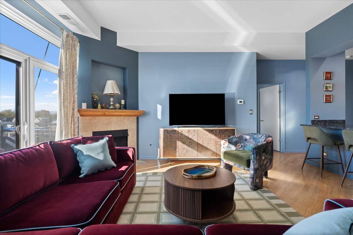 2337 West Wolfram Street, Unit 514 Chicago, IL 60618 - Photo 4 of 15 a living room with furniture and a flat screen tv