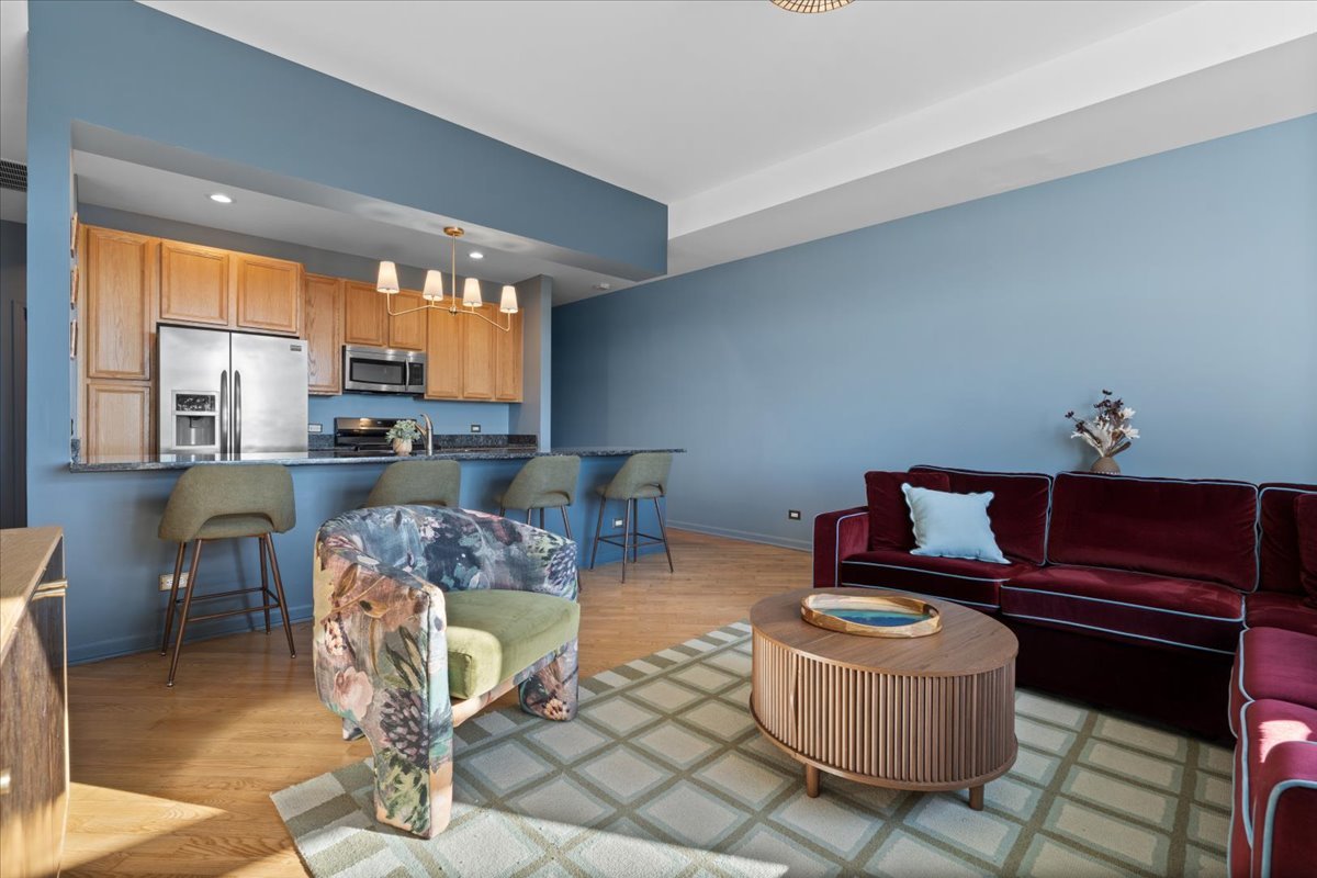 2337 West Wolfram Street, Unit 514 Chicago, IL 60618 - Photo 7 of 15 a living room with furniture and a large window