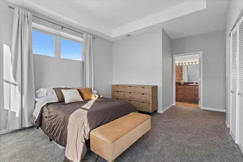 a bedroom with bed and window