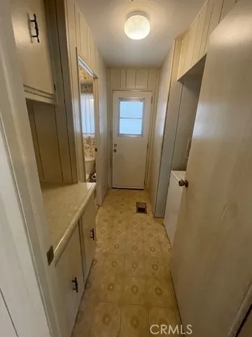 a bathroom with a sink and glass door shower