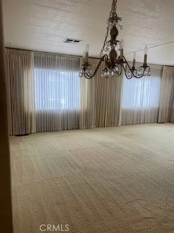 wooden floor in a hall with a window