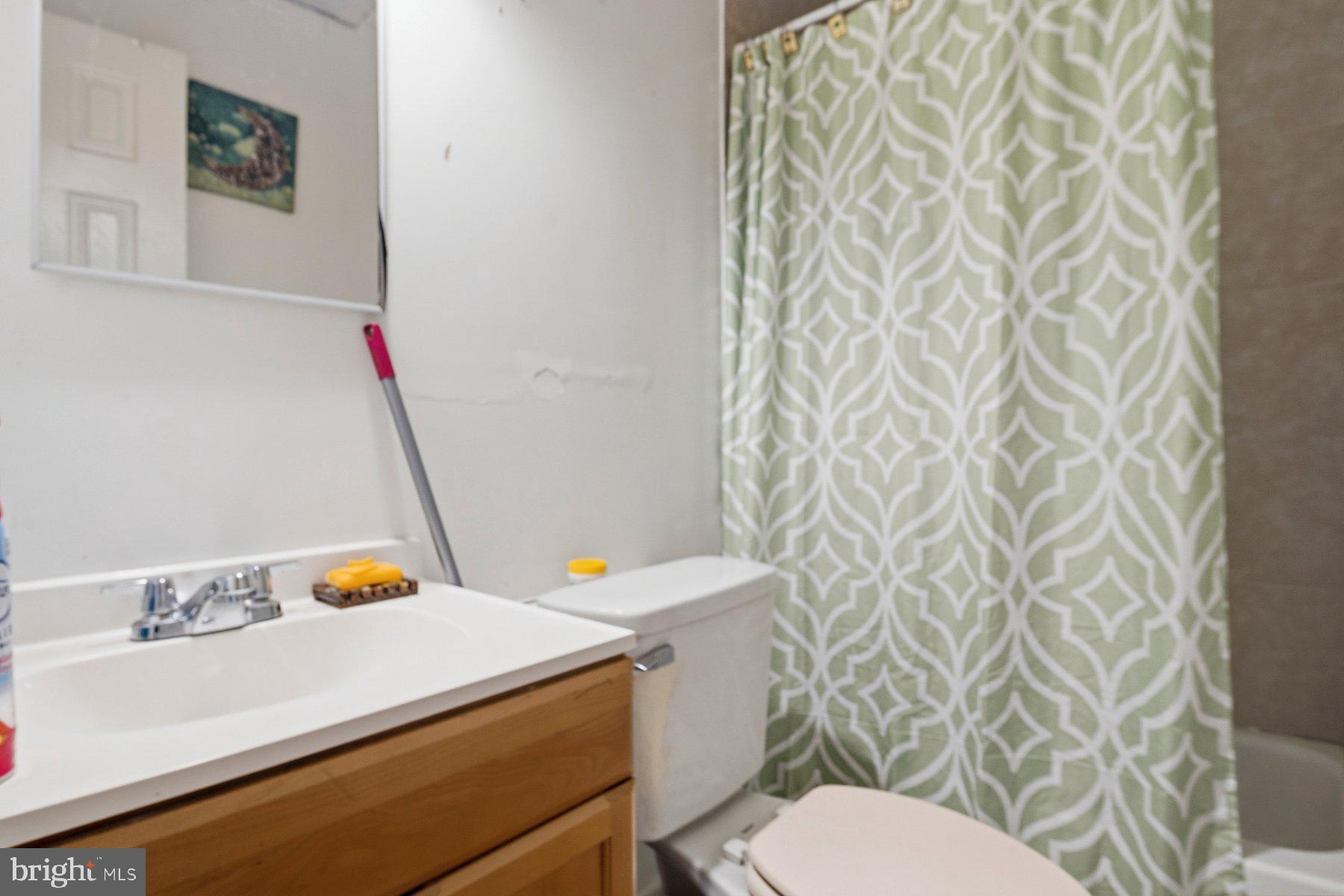 4931 Brookwood Road Baltimore, MD 21225 - Photo 6 of 25 a bathroom with a sink and a toilet