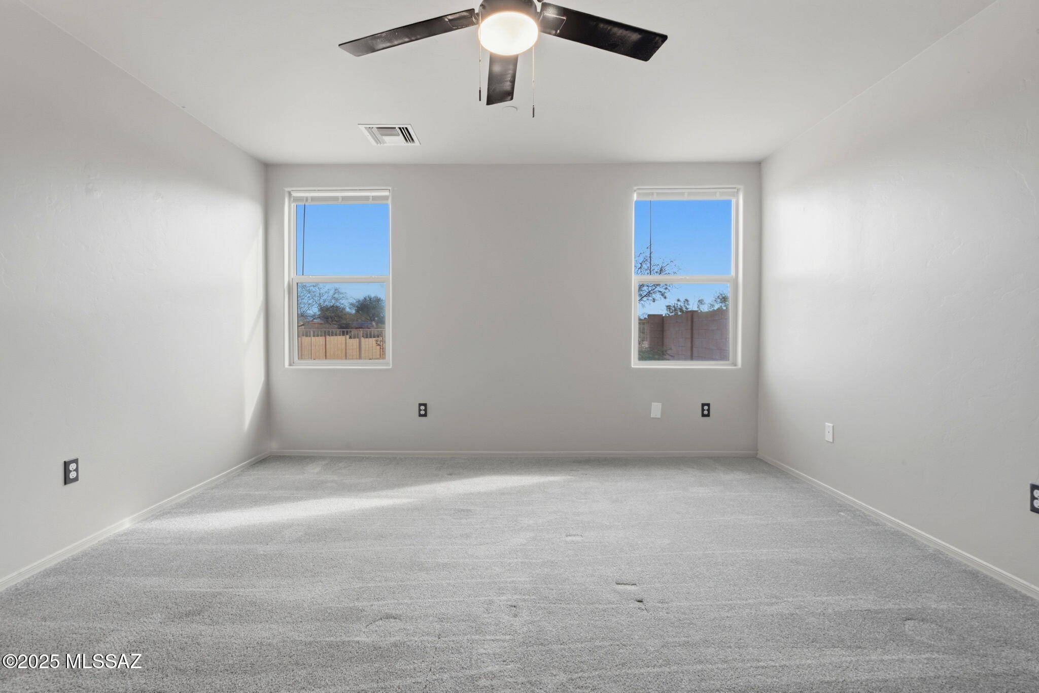 1458 North Wentworth Road Vail, AZ 85641 - Photo 18 of 44 a view of an empty room with a window