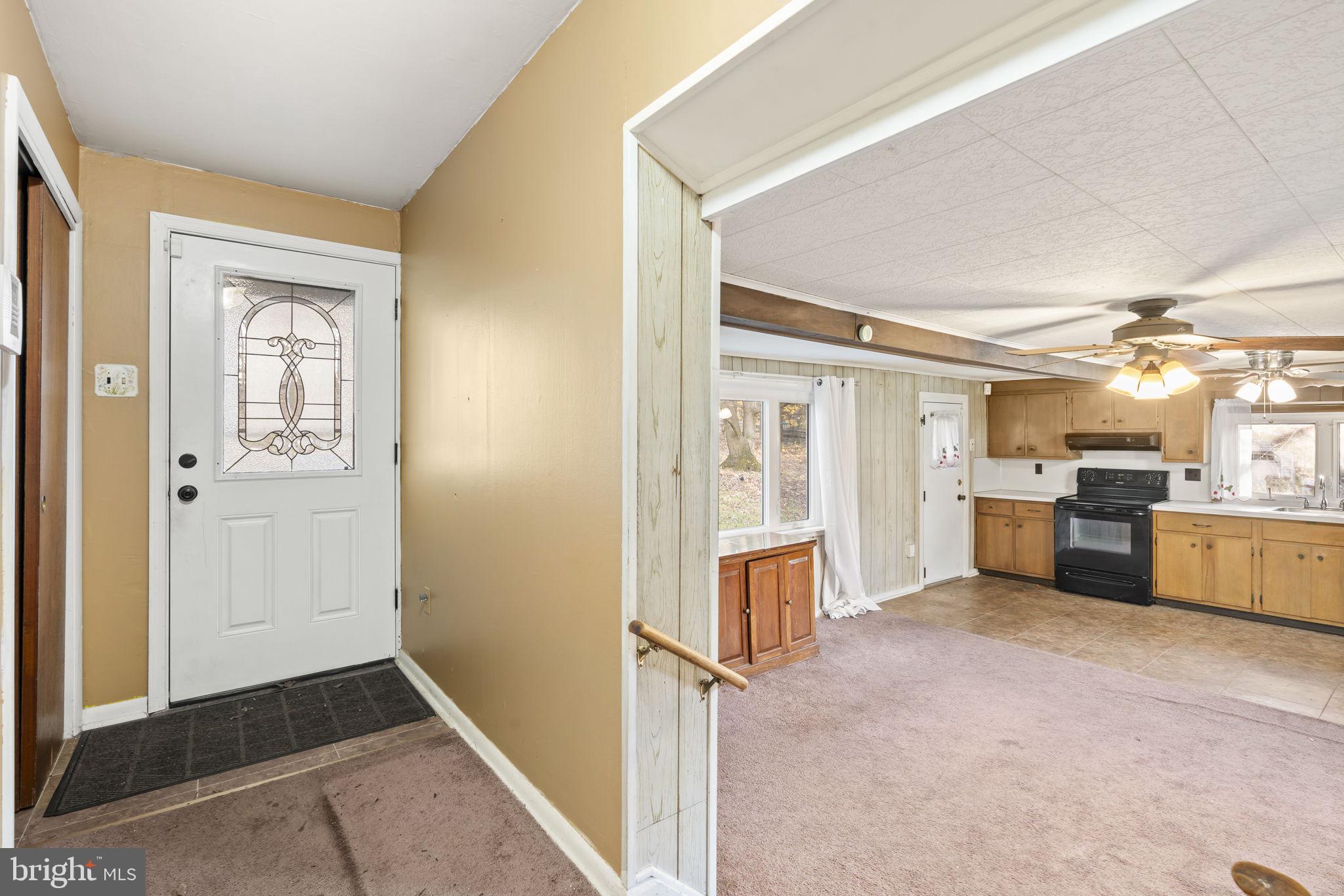 198 Glenrose Road Coatesville, PA 19320 - Photo 12 of 43 a view of a hallway with kitchen and entryway